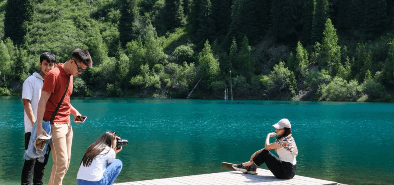Kayaking Across the Turquoise Waters of Lake Kaindy