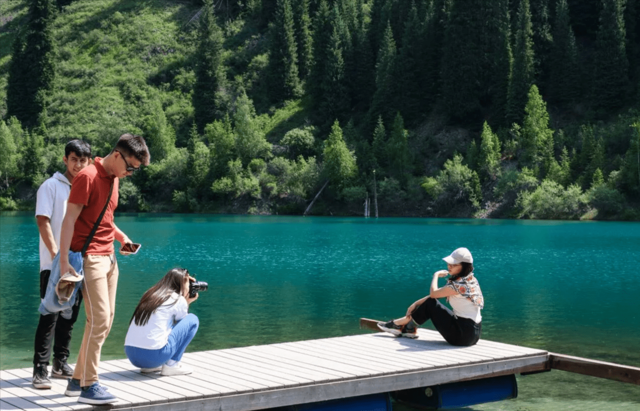 Kayaking Across the Turquoise Waters of Lake Kaindy